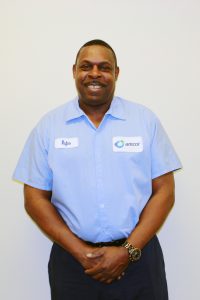 Rufus proudly shares his success story and shows off his Amcor uniform.